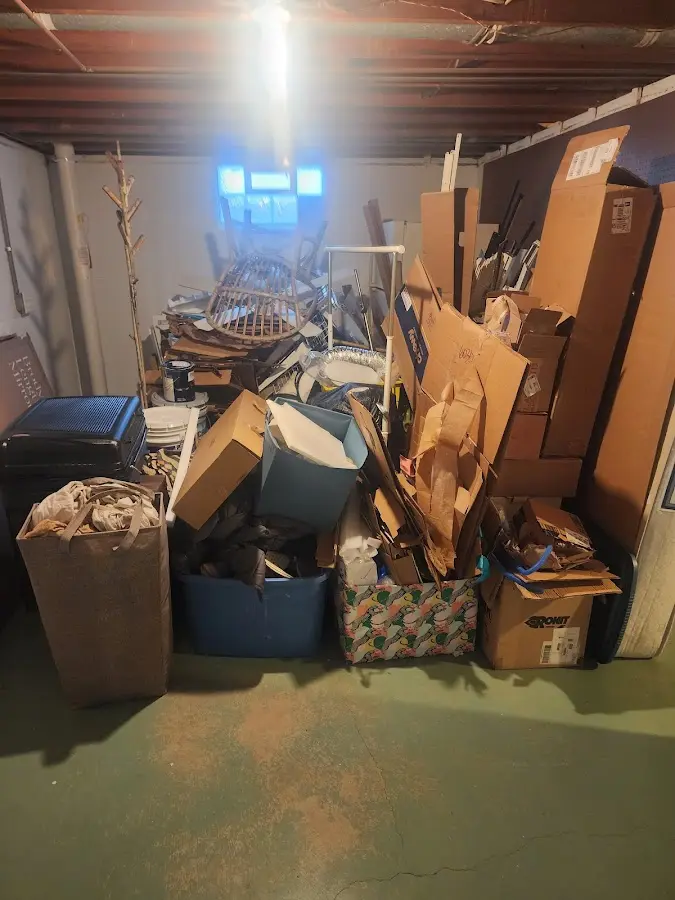 Roll-off dumpster container at job site for Yard Waste Dumpster Rental in Newfield